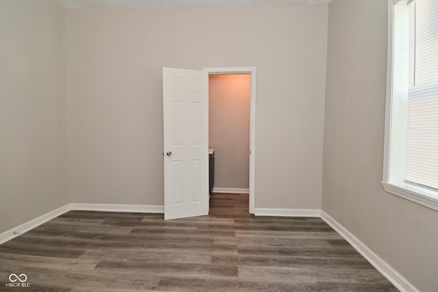 623 Orange St, Indianapolis, IN 46203 - empty room with dark wood-style flooring and baseboards