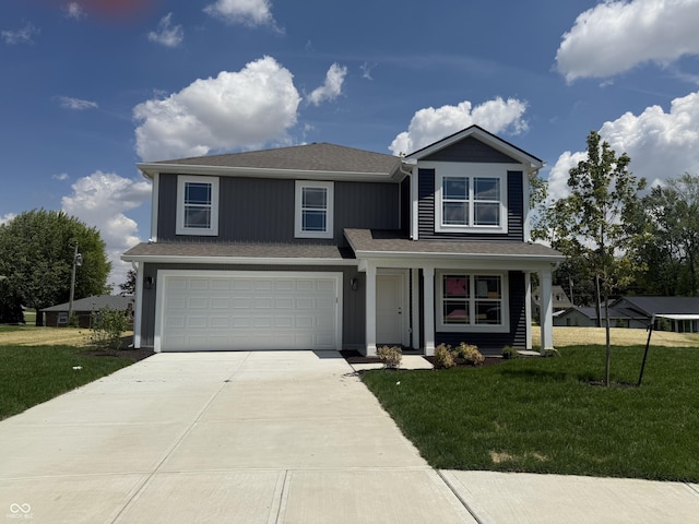24391 Stout St, Sheridan, IN 46069 - traditional-style house with driveway, a garage, and a front yard