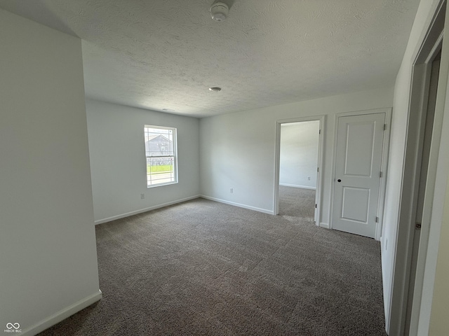 24391 Stout St, Sheridan, IN 46069 - carpeted empty room featuring baseboards, a textured ceiling, and a smoke detector