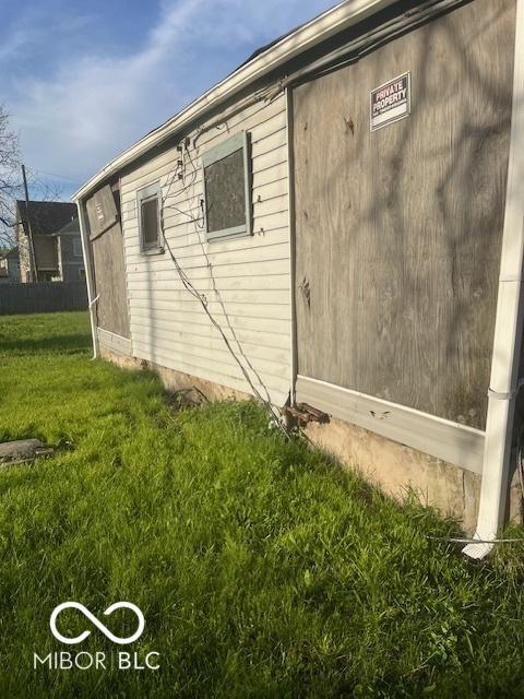 view of home's exterior featuring a yard
