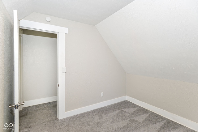 1115 N Keystone Ave, Indianapolis, IN 46201 - additional living space featuring lofted ceiling, carpet flooring, and baseboards