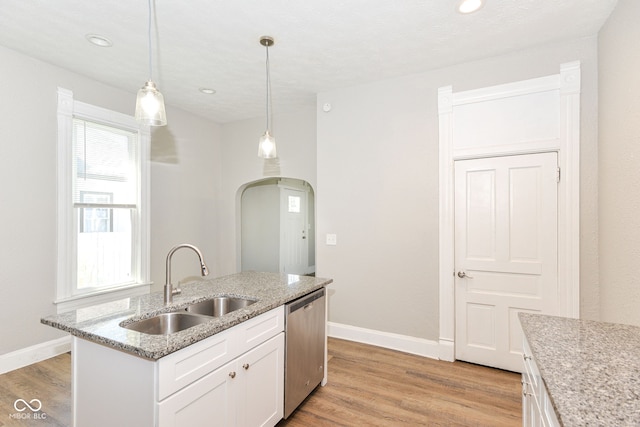 1115 N Keystone Ave, Indianapolis, IN 46201 - kitchen with a sink, dishwasher, baseboards, light wood finished floors, and white cabinets