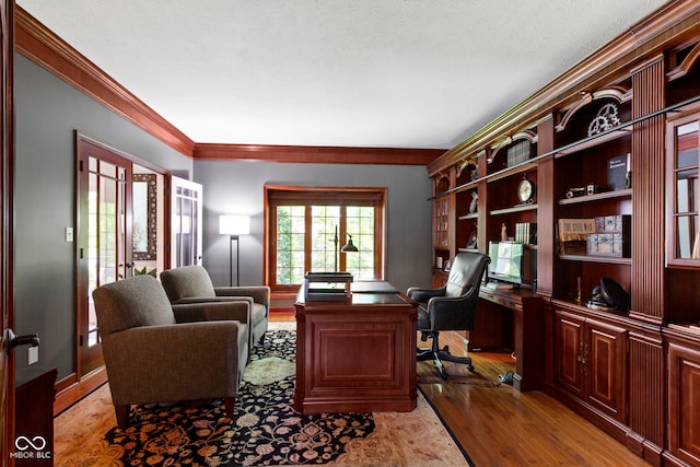 office with wood finished floors and crown molding