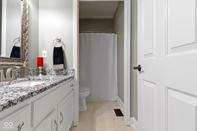 full bathroom with crown molding, vanity, tile patterned floors, toilet, and baseboards