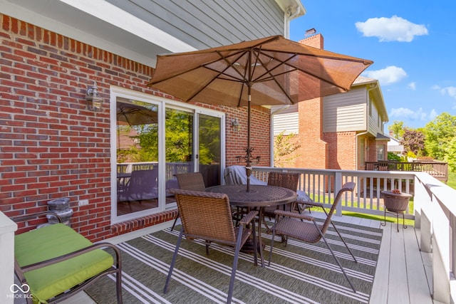 deck featuring outdoor dining space
