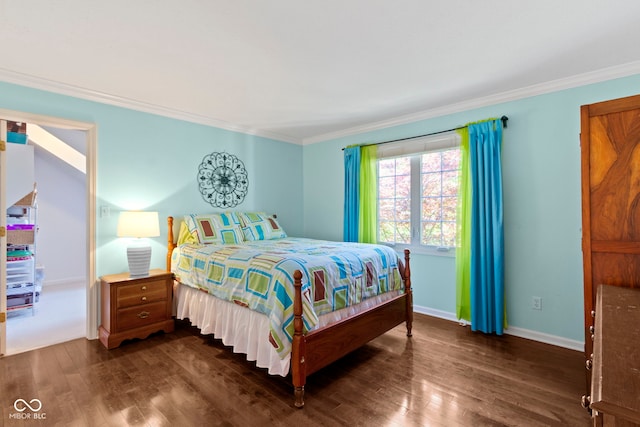 bedroom with dark wood-style flooring, ornamental molding, and baseboards