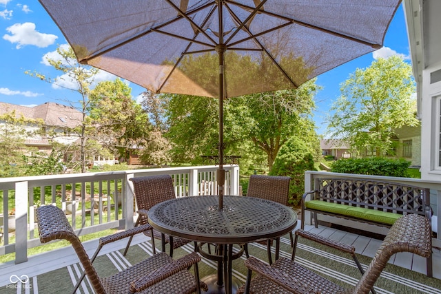 wooden deck featuring outdoor dining space