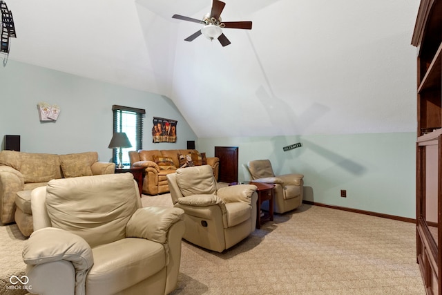 home theater room with lofted ceiling, a ceiling fan, light carpet, and baseboards