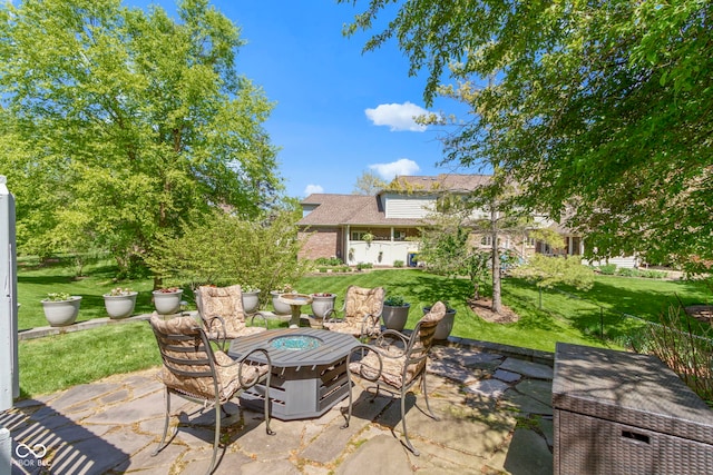 view of patio with a fire pit