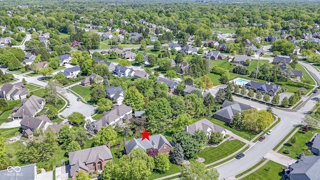 aerial view of property's location with nearby suburban area