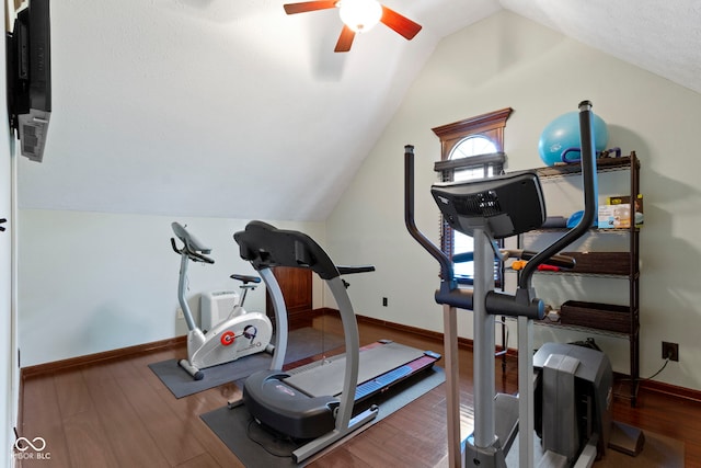 workout room with vaulted ceiling, a ceiling fan, baseboards, and wood finished floors