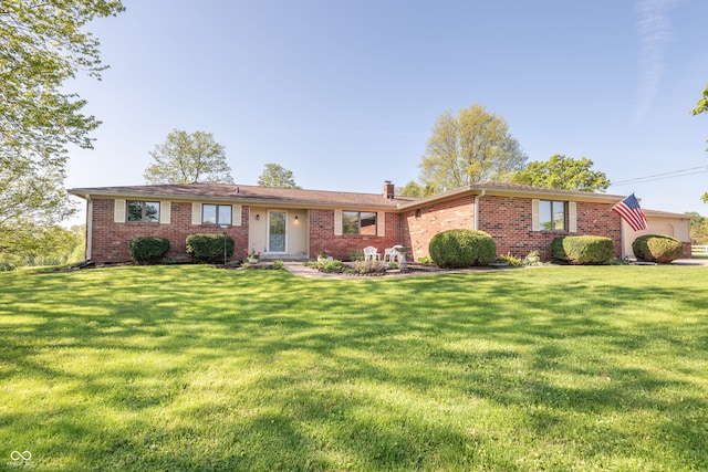 3250 E Bethel Ln, Bloomington, IN 47408 - single story home with a chimney, a front yard, brick siding, and an attached garage