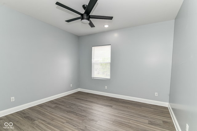 unfurnished room featuring dark wood-style floors, ceiling fan, baseboards, and recessed lighting