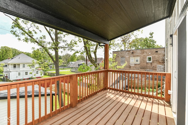 wooden terrace featuring a residential view