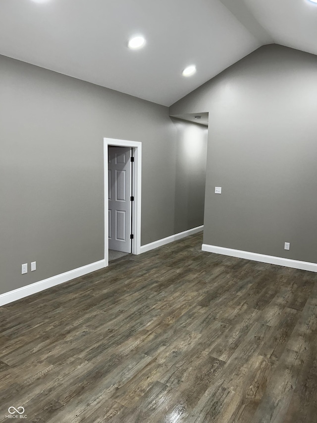 336 W 29th St, Indianapolis, IN 46208 - empty room with dark wood-style floors, baseboards, recessed lighting, and lofted ceiling