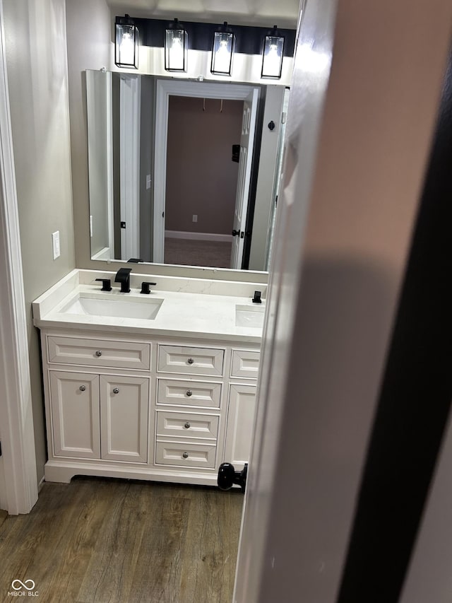 336 W 29th St, Indianapolis, IN 46208 - full bathroom with wood finished floors and double vanity