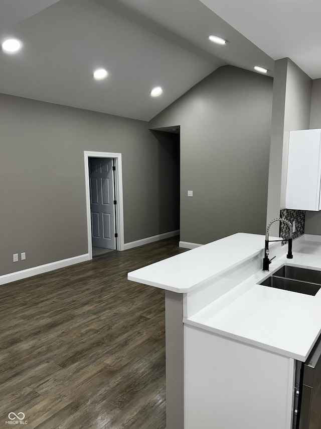 336 W 29th St, Indianapolis, IN 46208 - kitchen with a sink, light countertops, recessed lighting, dark wood-type flooring, and white cabinets