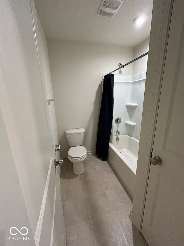 13460 Dewpoint Ln, Fishers, IN 46037 - bathroom with toilet, shower / bath combo, tile patterned flooring, a textured ceiling, and baseboards