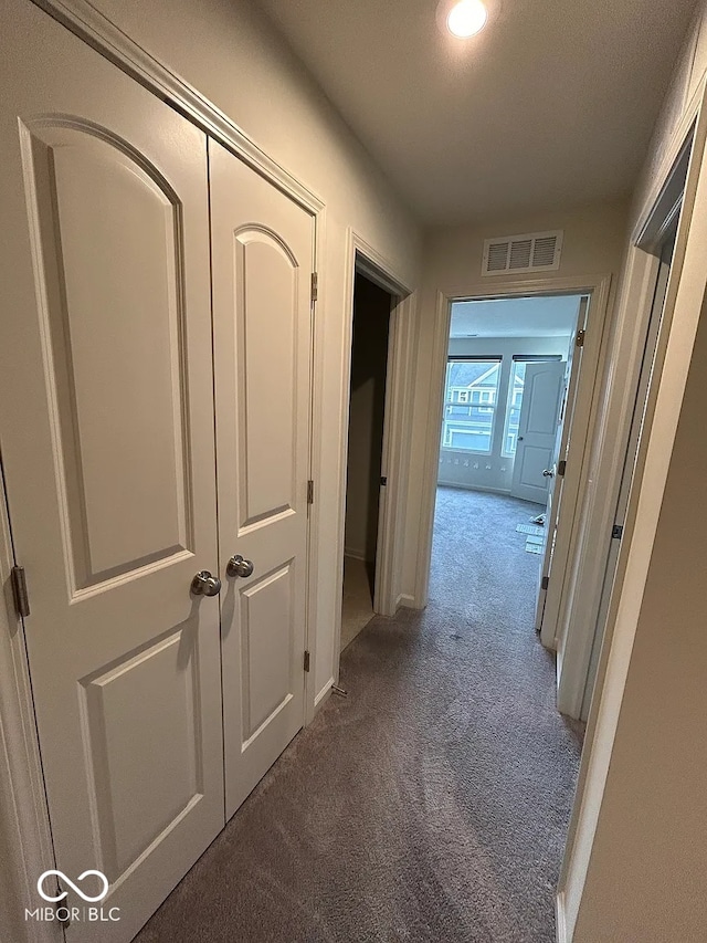 13460 Dewpoint Ln, Fishers, IN 46037 - hall featuring dark colored carpet and baseboards