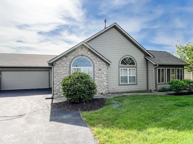 16657 Brownstone Ct, Westfield, IN 46074 - ranch-style house featuring concrete driveway, a garage, stone siding, a front lawn, and a shingled roof
