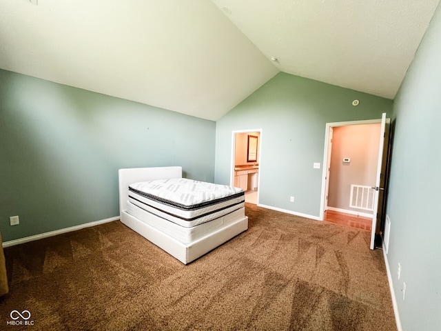 16657 Brownstone Ct, Westfield, IN 46074 - bedroom with carpet flooring, vaulted ceiling, baseboards, and ensuite bathroom