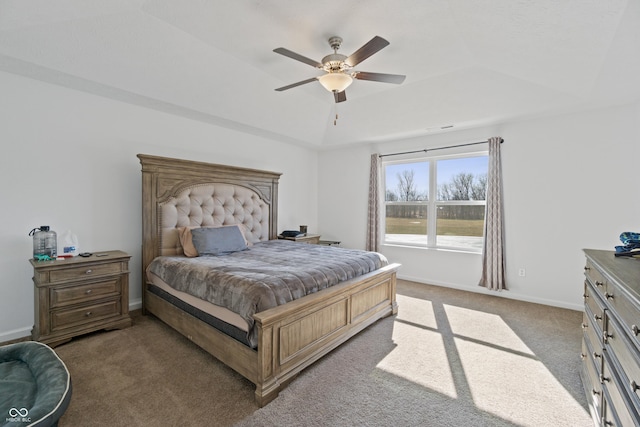 6903 Aster Dr, Pendleton, IN 46064 - bedroom with light colored carpet, a tray ceiling, a ceiling fan, and baseboards