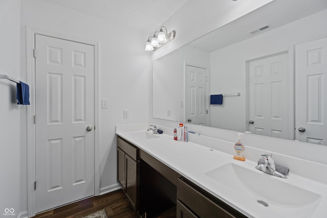 6903 Aster Dr, Pendleton, IN 46064 - bathroom featuring wood finished floors and double vanity