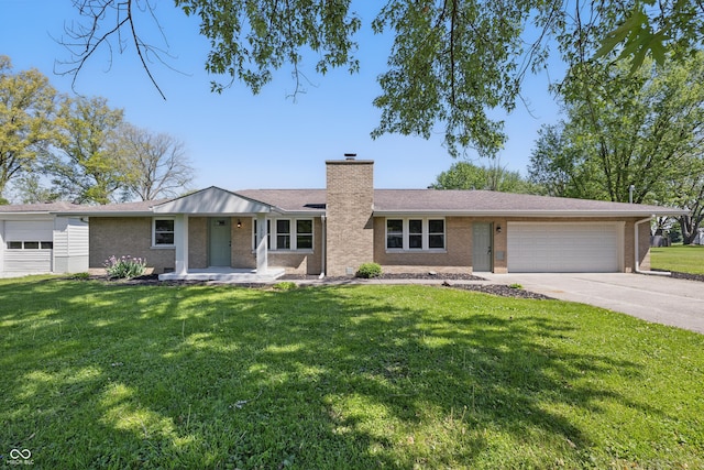 1328 Toner Dr, Anderson, IN 46012 - ranch-style home featuring an attached garage, brick siding, a chimney, driveway, and a front yard