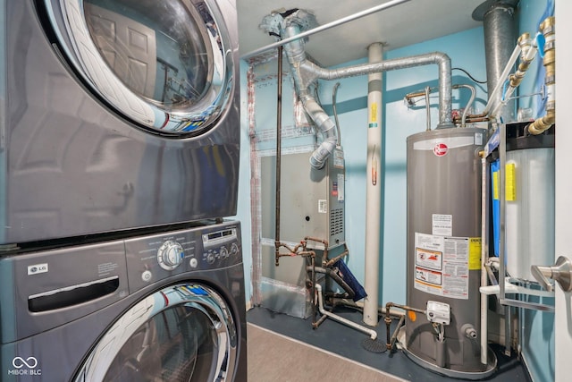 clothes washing area with gas water heater and stacked washing machine and dryer