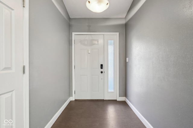 entryway featuring baseboards