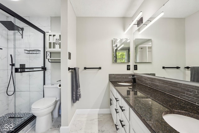 bathroom with marble finish flooring, a marble finish shower, toilet, and baseboards
