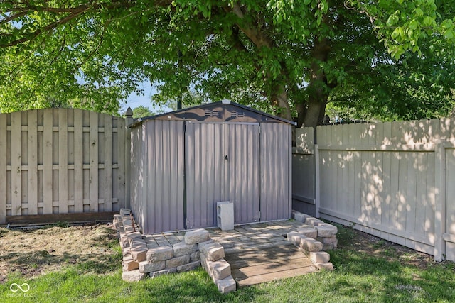 view of shed with a fenced backyard