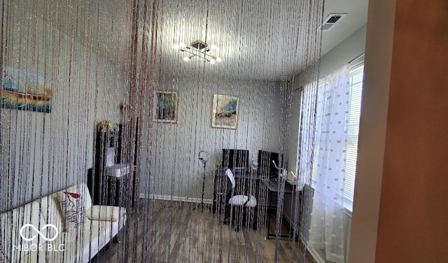 home office with baseboards and wood finished floors