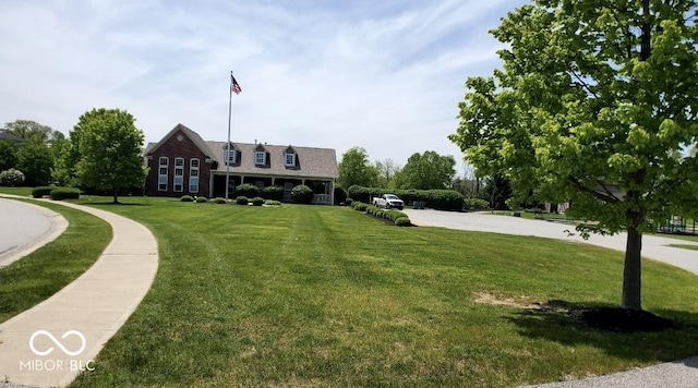view of property's community featuring a yard