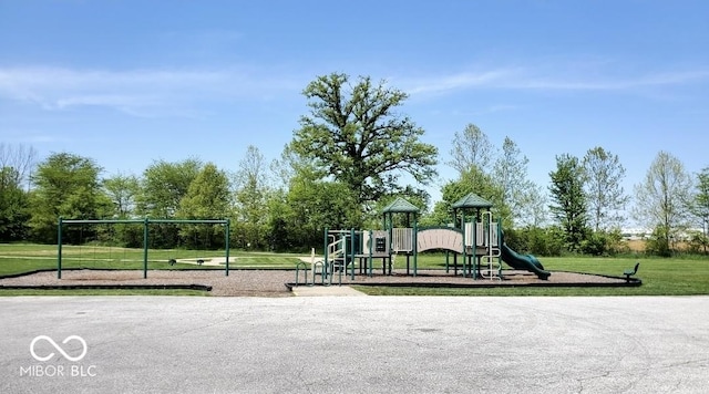 community jungle gym with a lawn