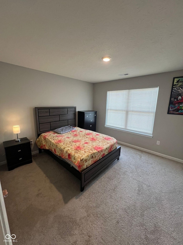 carpeted bedroom with baseboards