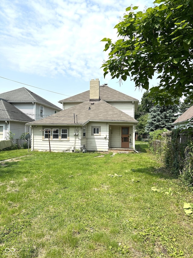 205 N Sheffield Ave, Indianapolis, IN 46222 - back of property featuring a chimney and a shingled roof