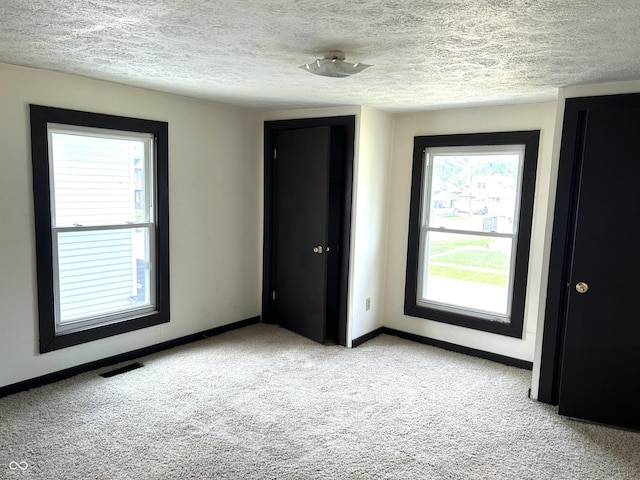 205 N Sheffield Ave, Indianapolis, IN 46222 - unfurnished room featuring carpet floors, baseboards, and a textured ceiling