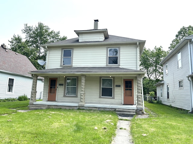 205 N Sheffield Ave, Indianapolis, IN 46222 - traditional style home featuring a porch, a front yard, and a chimney