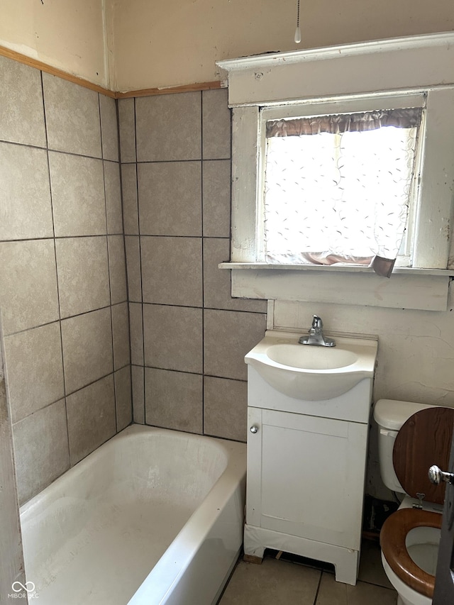 205 N Sheffield Ave, Indianapolis, IN 46222 - full bath with toilet, tile patterned flooring, vanity, and tile walls