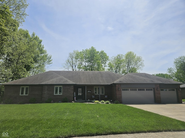 ranch-style house featuring brick siding, an attached garage, a front yard, concrete driveway, and roof with shingles