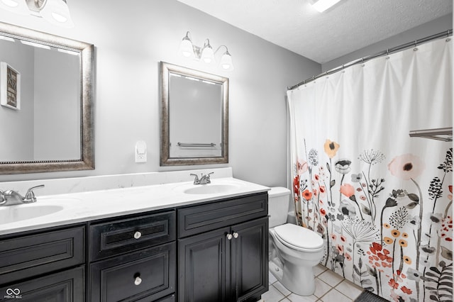 full bath with toilet, double vanity, a textured ceiling, tile patterned floors, and a shower with curtain