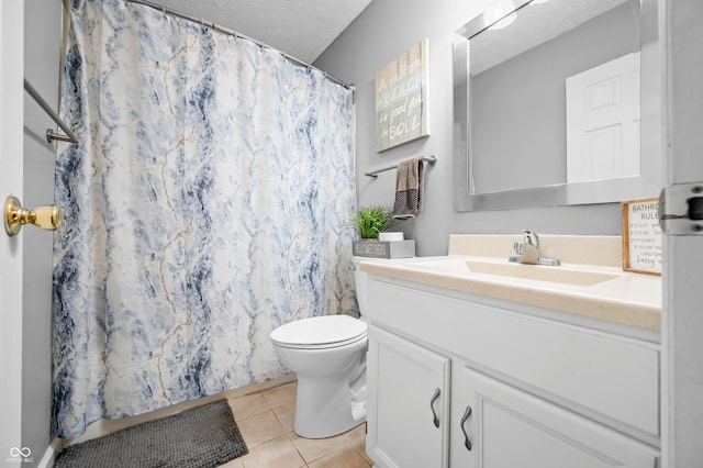 bathroom featuring tile patterned flooring, toilet, a textured ceiling, vanity, and a shower with shower curtain