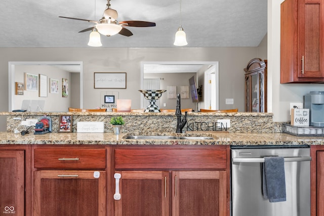 kitchen featuring dishwasher, a sink, a ceiling fan, light stone counters, and a textured ceiling