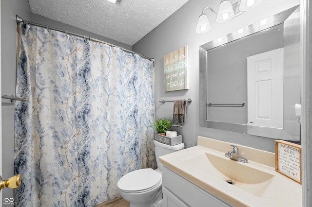 bathroom featuring a textured ceiling, toilet, vanity, and curtained shower