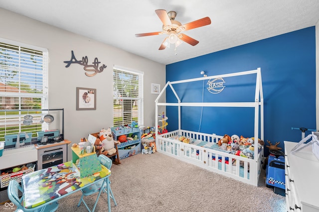 bedroom with carpet and a ceiling fan
