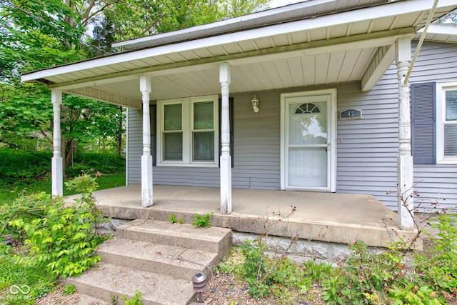 doorway to property with a porch
