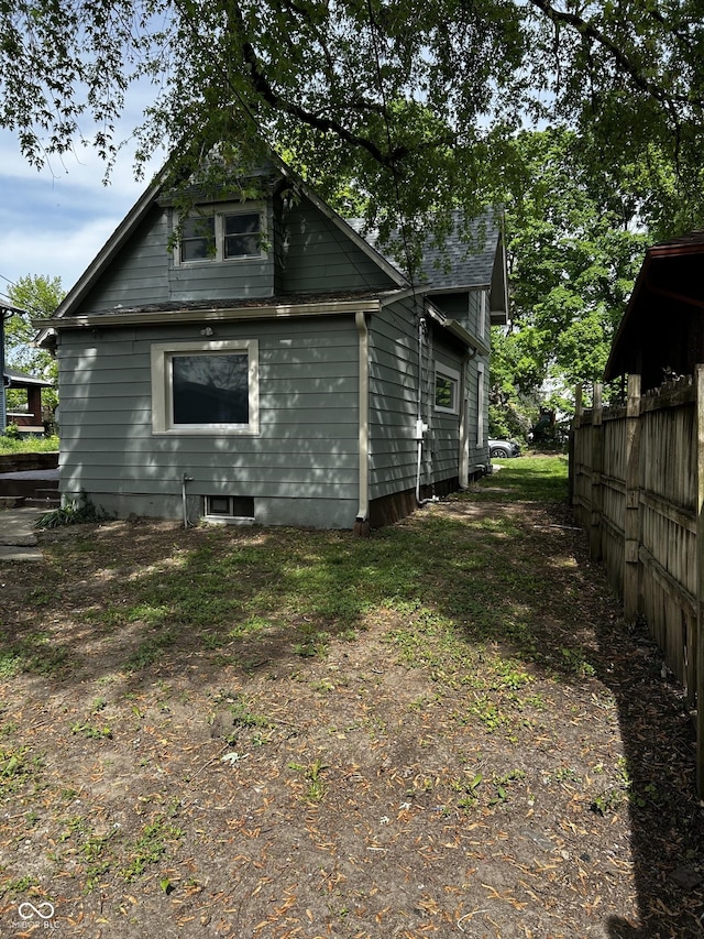 back of property with fence