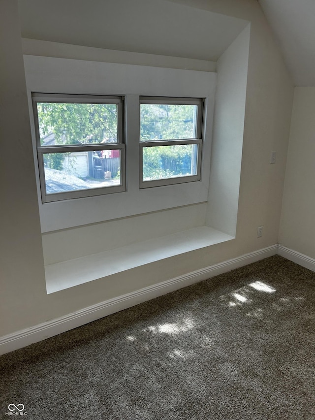 bonus room featuring carpet floors, vaulted ceiling, and baseboards