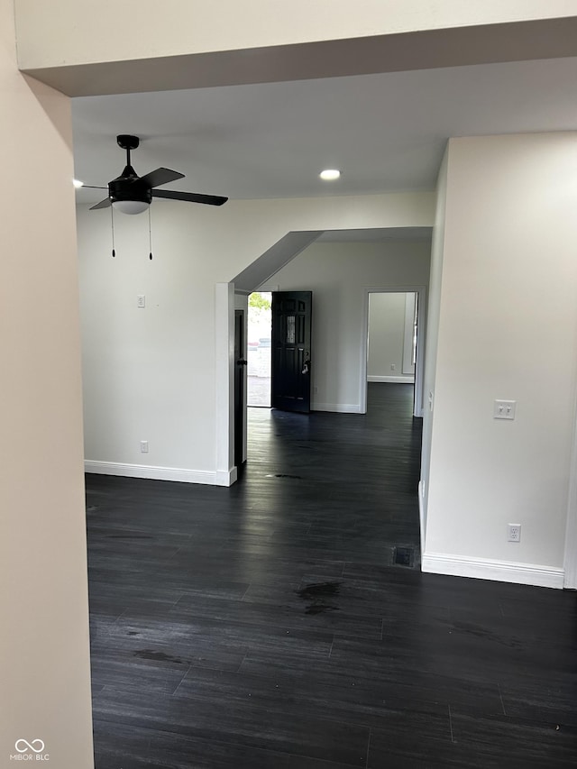 unfurnished room with baseboards, ceiling fan, dark wood finished floors, and recessed lighting